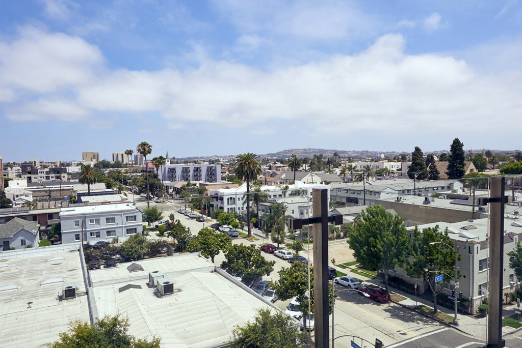 the view of the city from the roof of a building