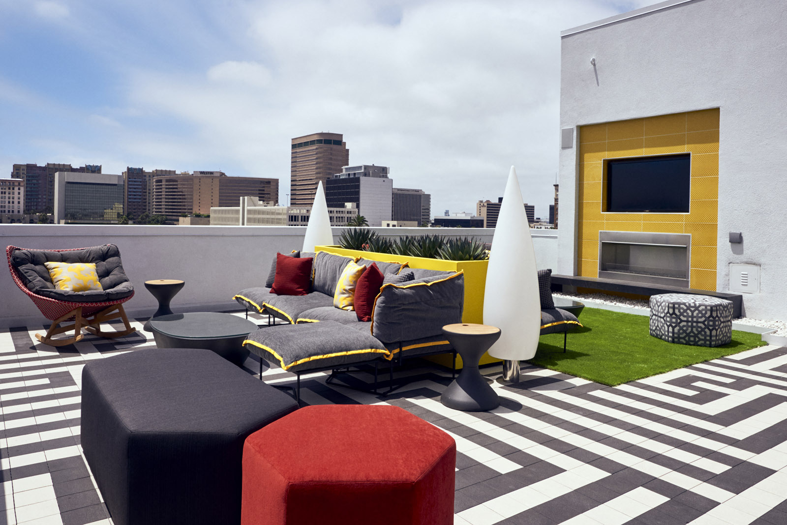 Long Beach Apartments for Rent-The Linden Apartments Rooftop Deck With Shuffleboard Game And Seating Area And City Views