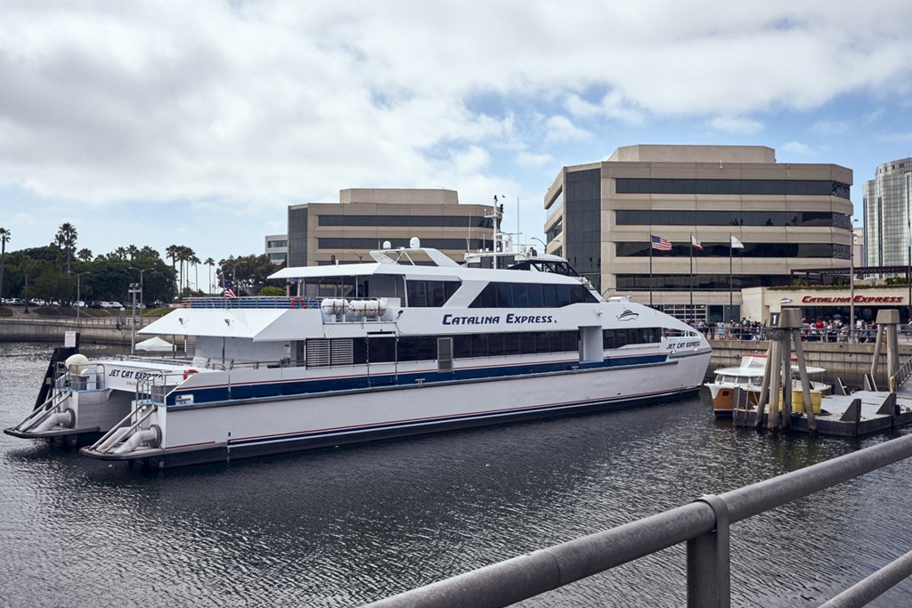 a large boat is docked at a dock in a harbor