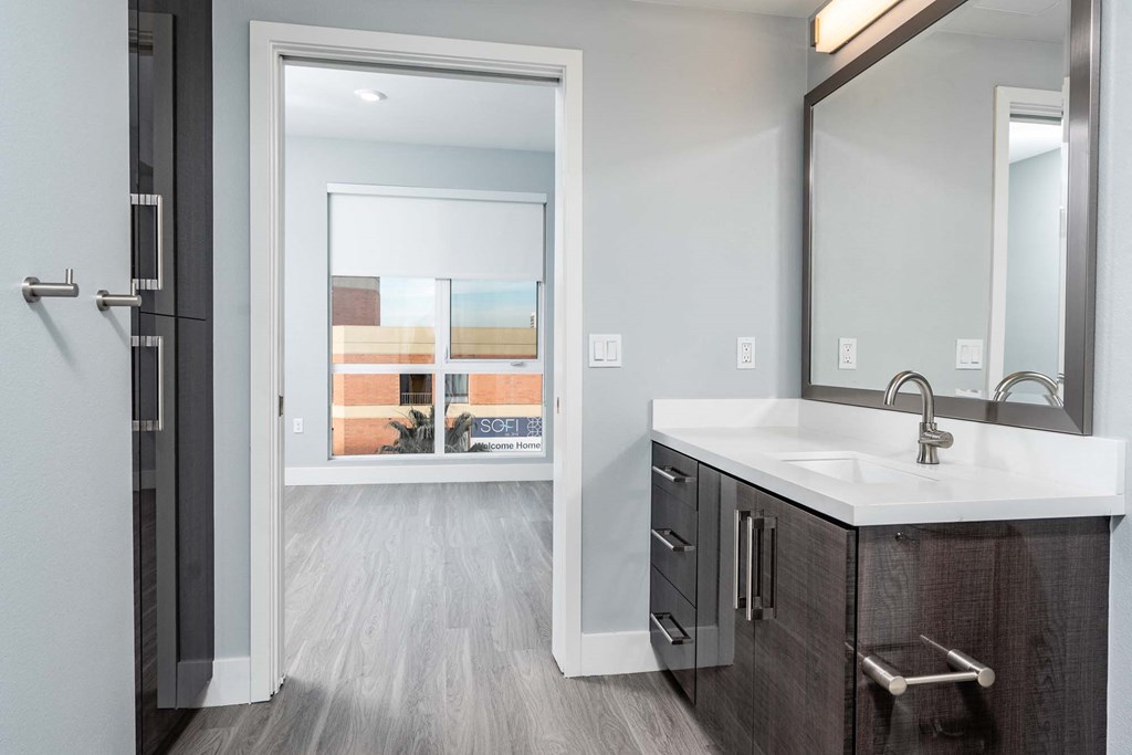 a bathroom with a sink and a window
