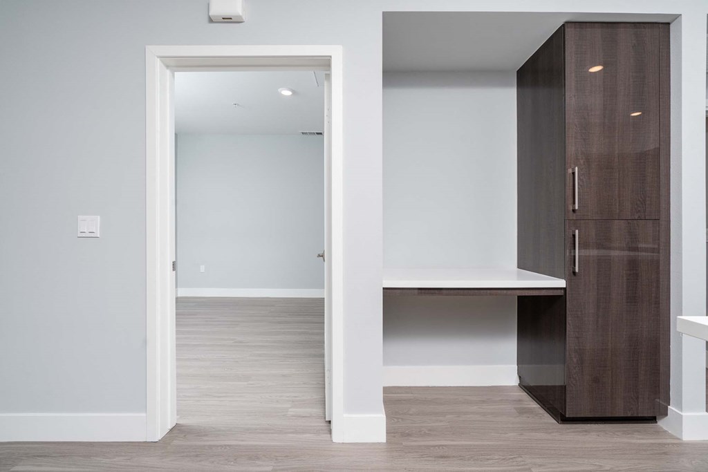 a bedroom with a closet and a mirror