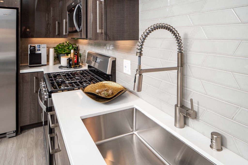 a kitchen with stainless steel appliances and a sink