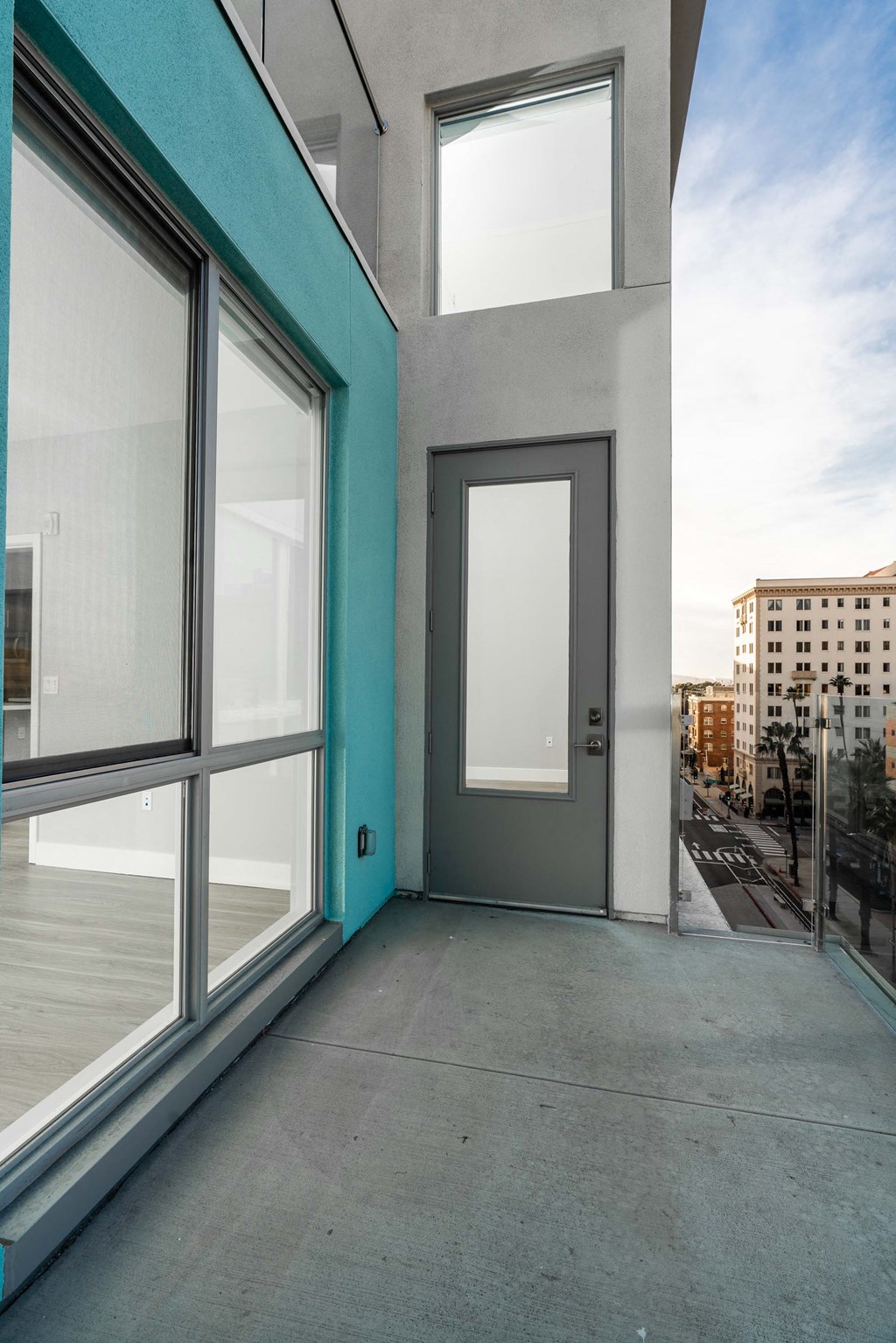 a door on the side of a building with a city in the background