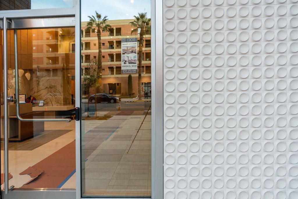 a view of the facade of a building through a glass window