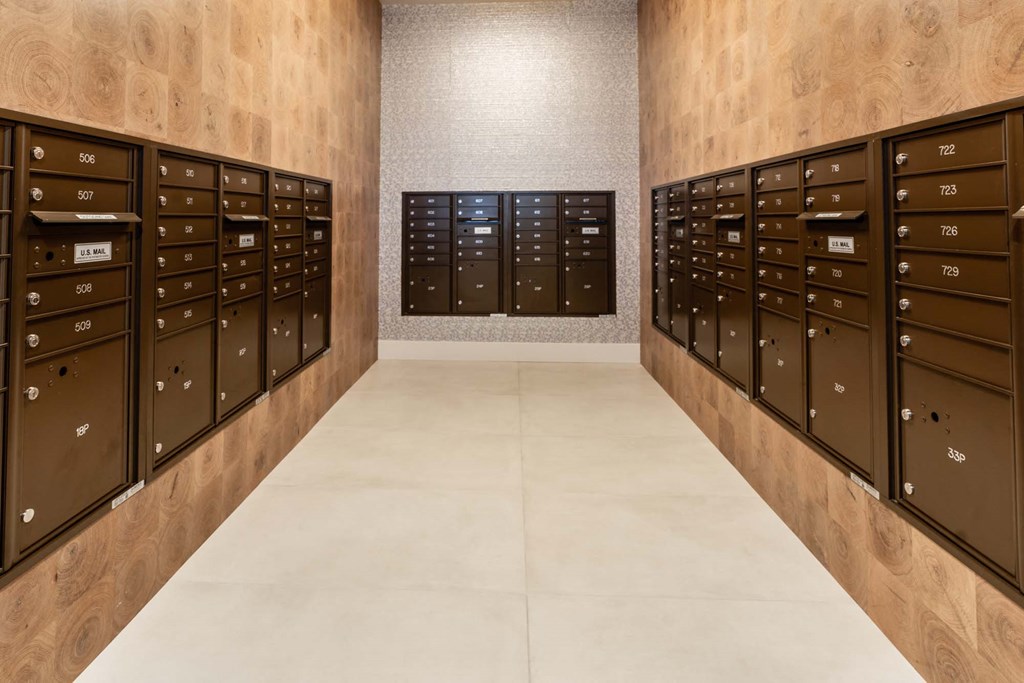 a locker room with wooden lockers and a marble floor