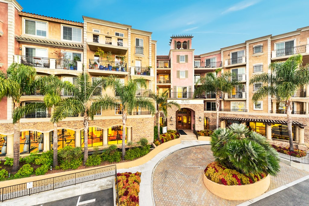 a building with palm trees in front of it