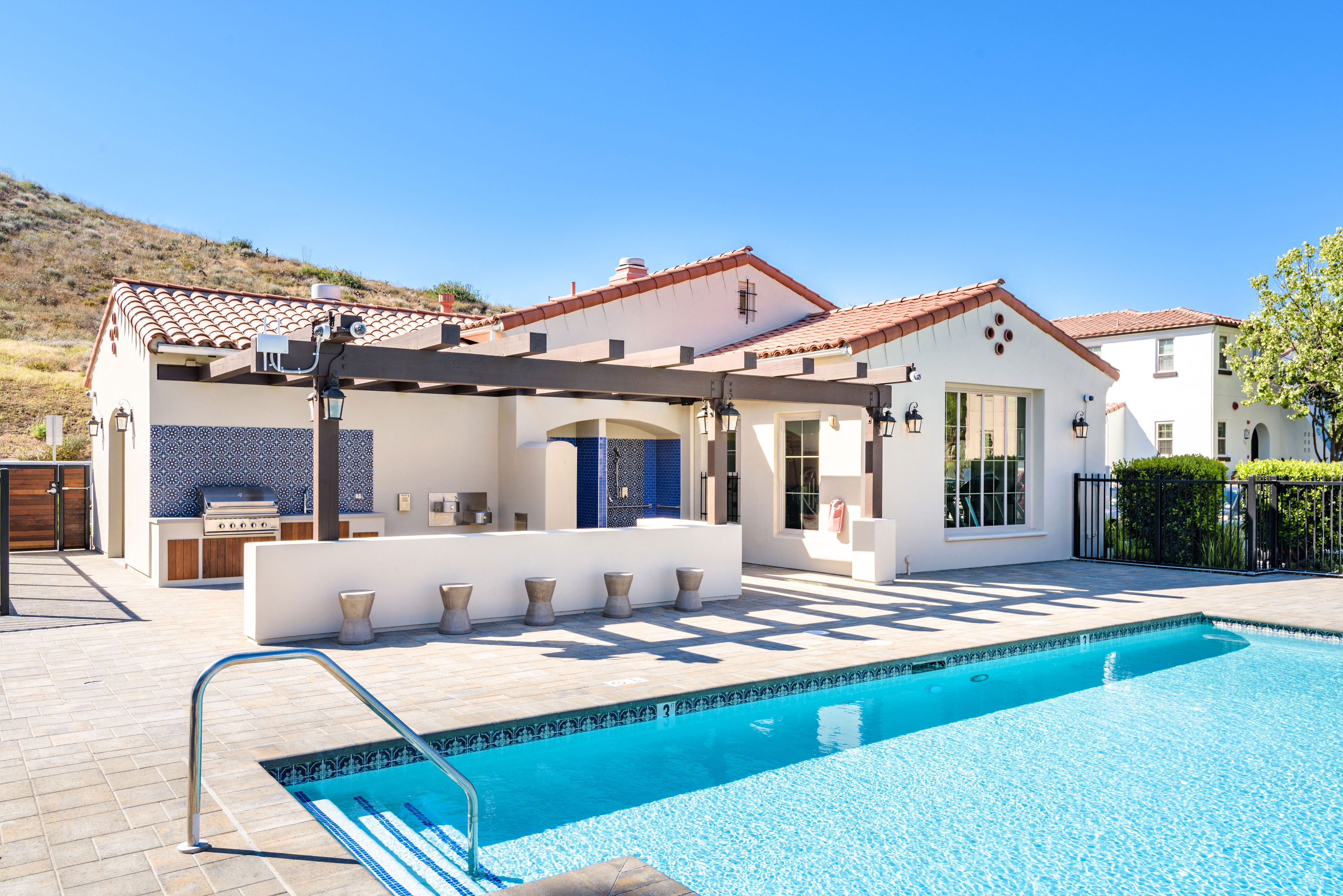 a swimming pool in front of a house