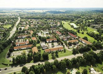 an aerial view of a suburban neighborhood with houses and trees