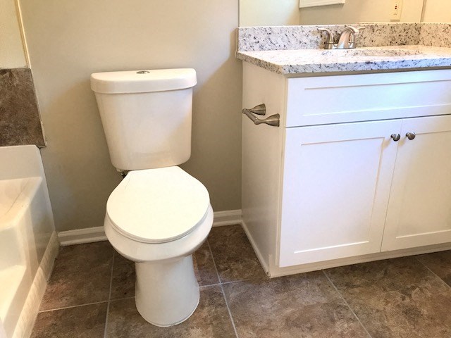 a bathroom with a toilet and a sink