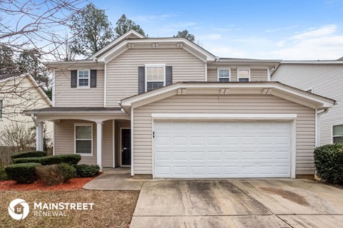 a white house with a white garage door