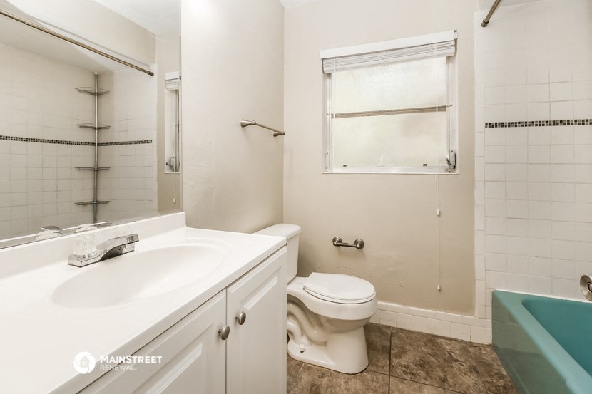a bathroom with a sink toilet and a shower