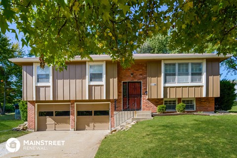 a house with a tree in front of it