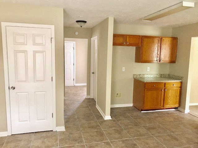 an empty kitchen with a white door