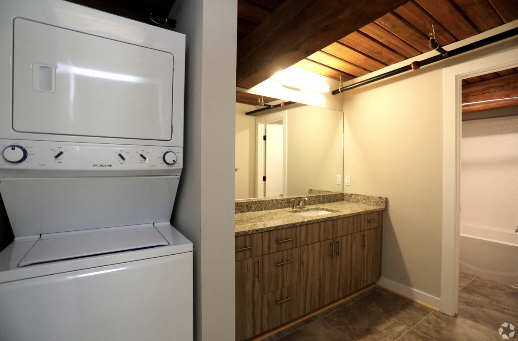the laundry room has a washer and dryer and a sink