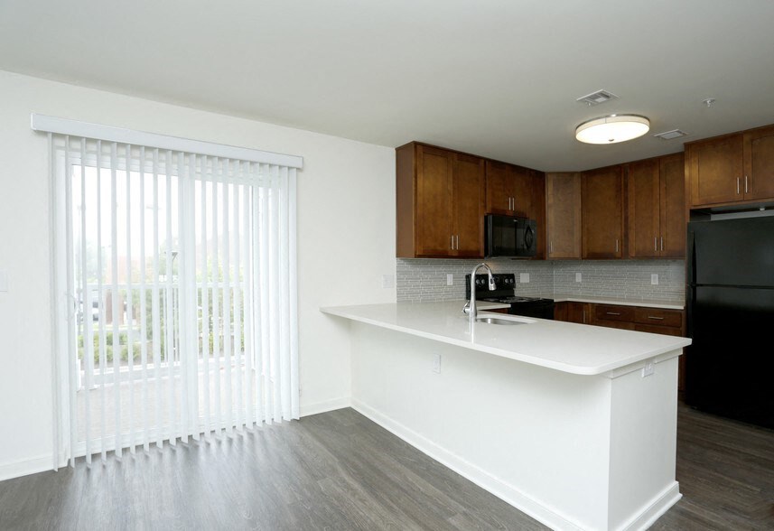 a kitchen with a counter and a large window