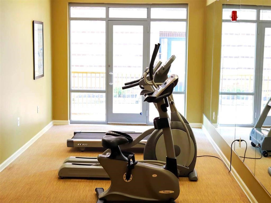 Fitness Room a home gym with a treadmill and exercise equipment