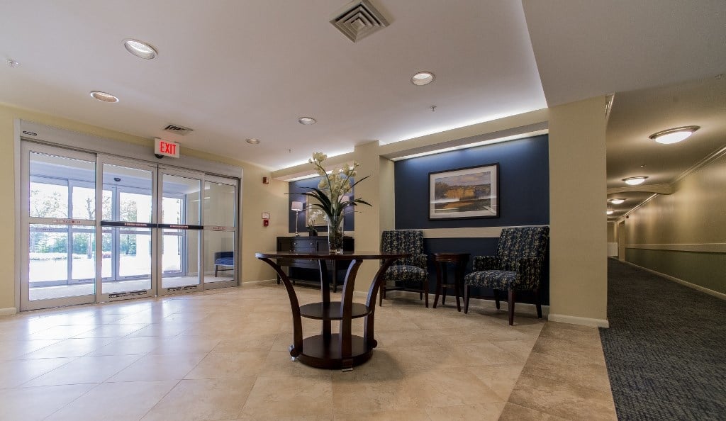 a dining area with a table and chairs in a lobby