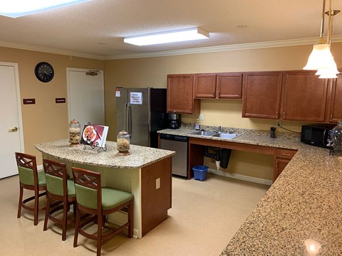 a kitchen with a bar and a counter top