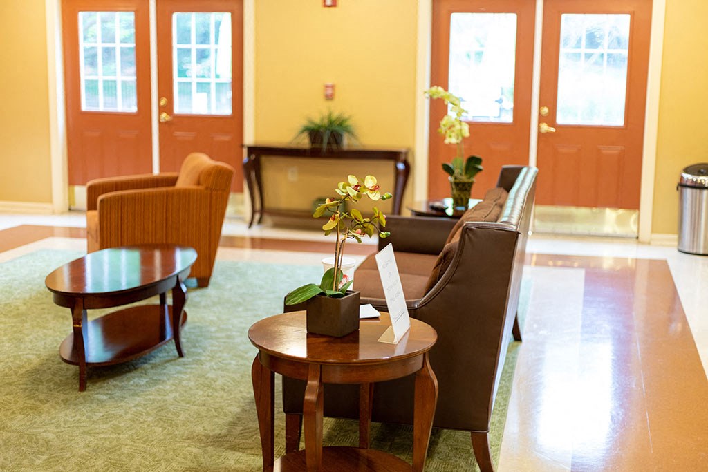Bright and welcoming community room at Park View at Randallstown with seating for resident activities, social gatherings, and events.