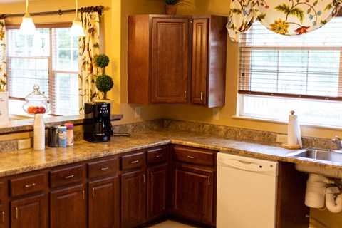 a kitchen with wooden cabinets and a counter top