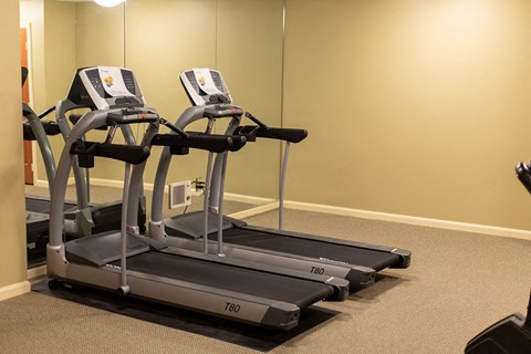 Modern on-site fitness center at Park View at Randallstown featuring exercise equipment designed to support active, healthy lifestyles for senior residents.