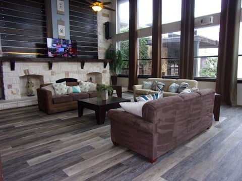 a living room with couches and a fireplace