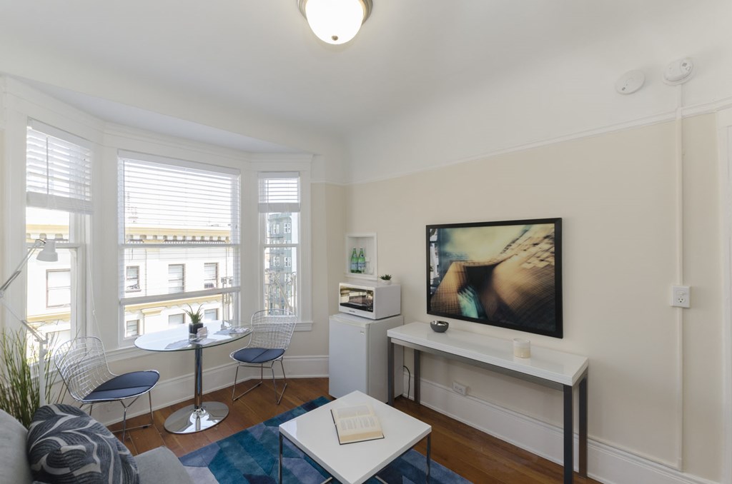 a living room with a couch and a table and a television
