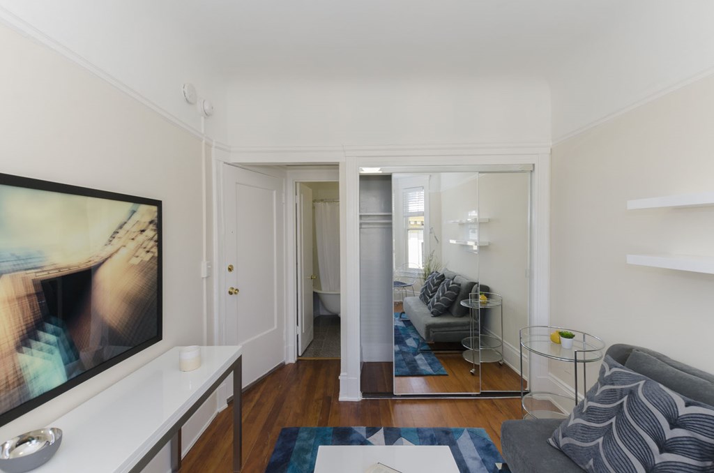 a living room with a couch and a tv