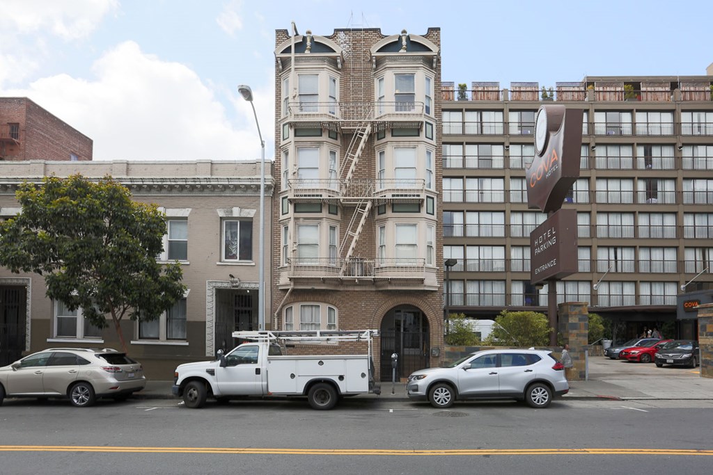 a truck parked in front of a building on a city street