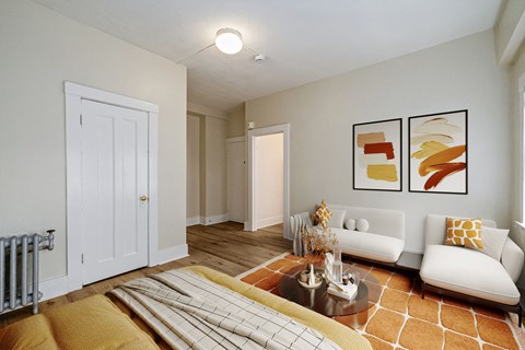 A living room with a white couch and a coffee table.