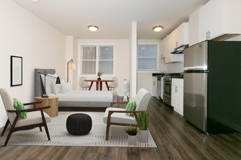 A modern kitchen with a refrigerator, sink, and stove.