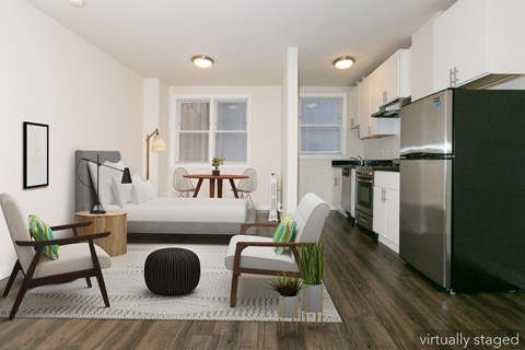 A modern kitchen with a refrigerator, stove, and oven.