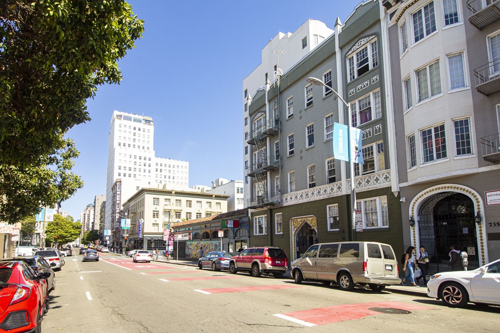 A street scene with cars and buildings.
