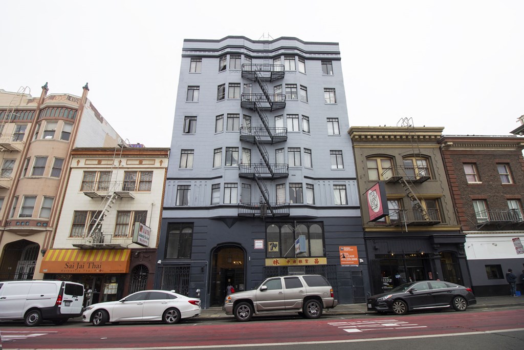 a building with a fire escape on a city street