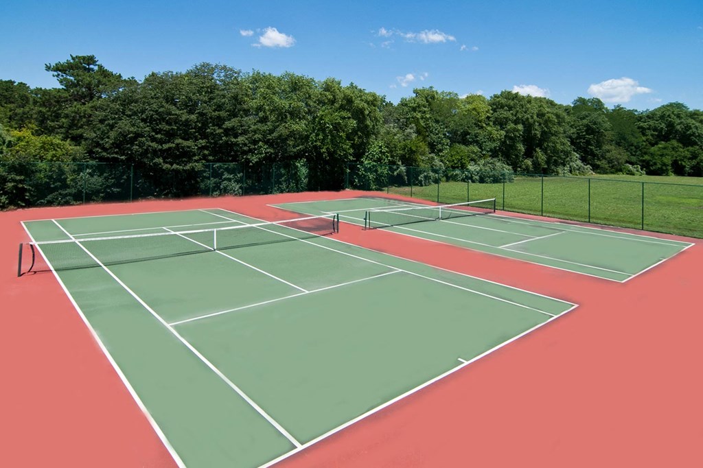 a tennis court with two nets on it