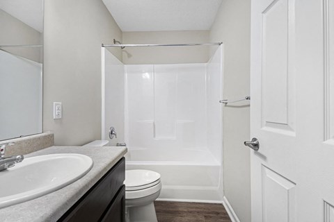 a bathroom with a sink toilet and a shower