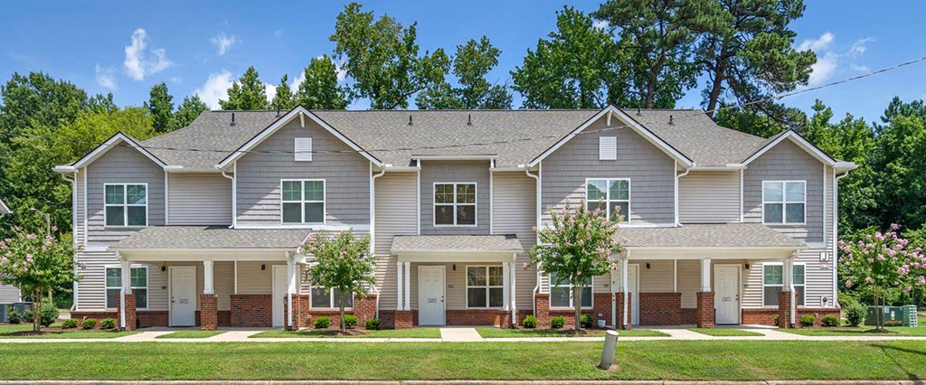 a large house with a lawn in front of it