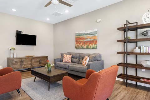 a living room with a couch and a tv