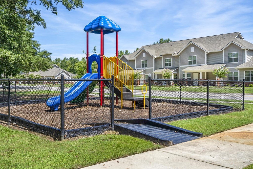 our apartments have a playground with a playset and slides