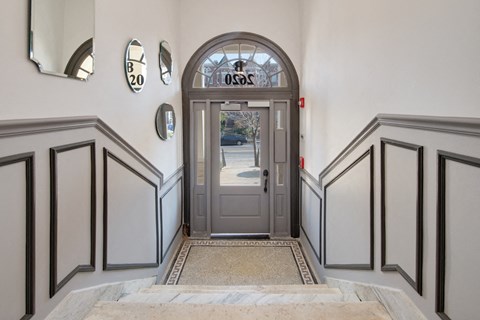 the entrance to a building with a door and a glass window