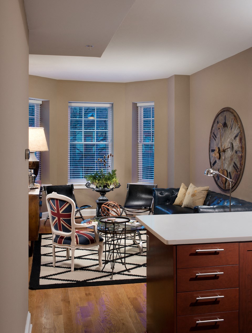 a living room with a couch and a table with chairs