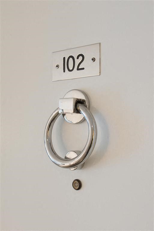 a white door handle with a silver door lock