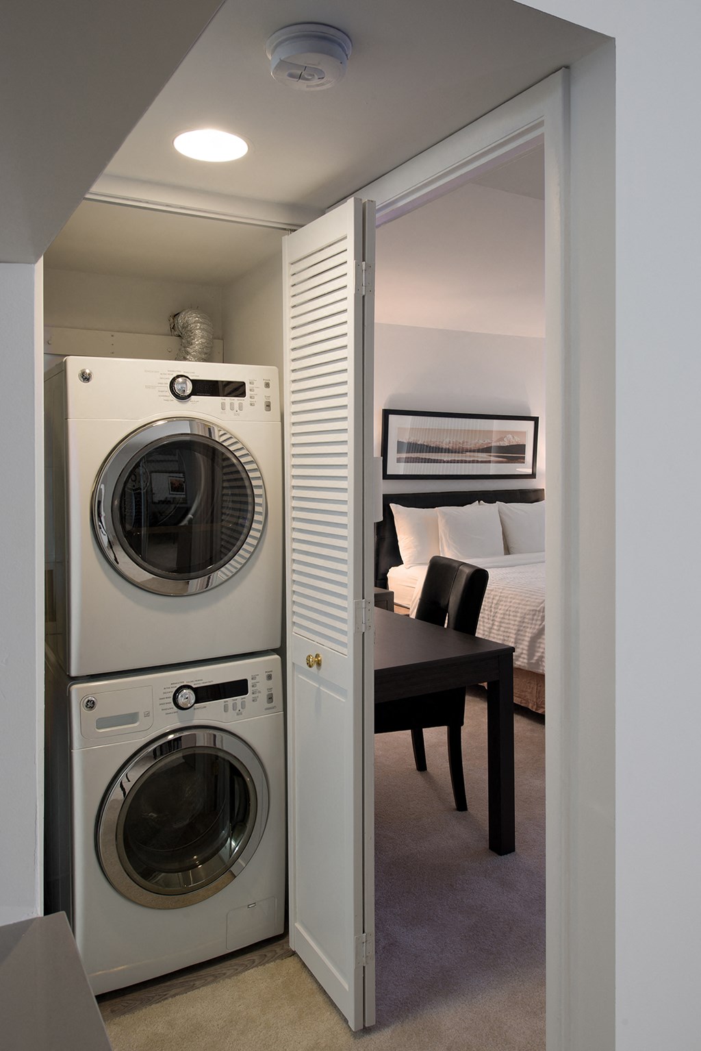 a small laundry room with a washing machine and a dryer
