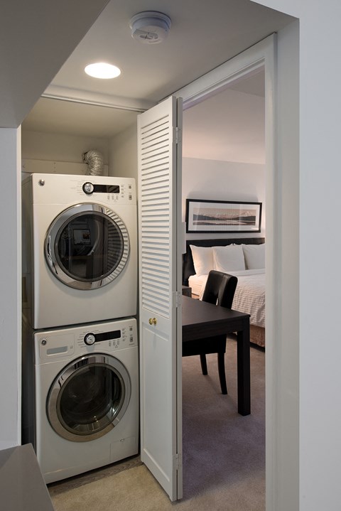 a small laundry room with a washing machine and a dryer