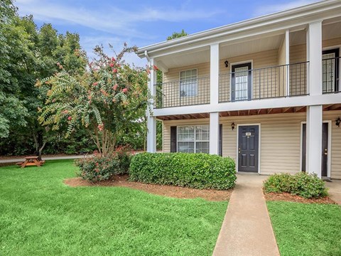 a house with a yard and a sidewalk
