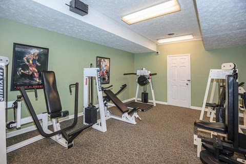 a gym with exercise equipment in a room