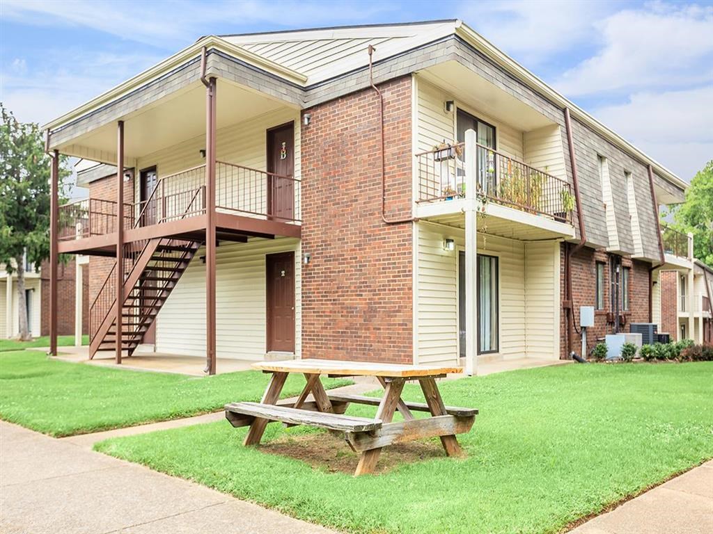 a picnic table in front of a building