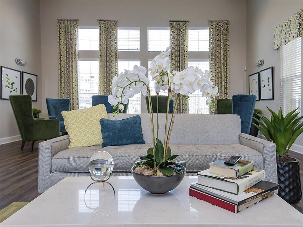 a living room with a couch and a table with books