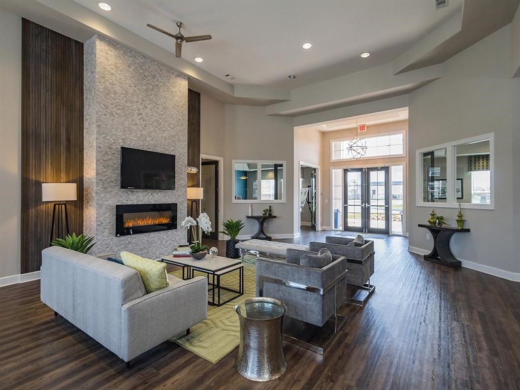 a living room with couches and a fireplace