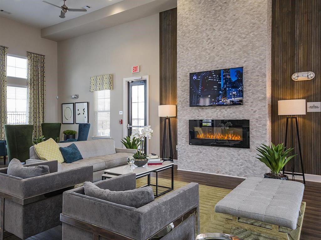 a living room with a fireplace and couches